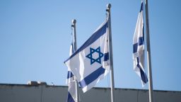 Israeli flags fly in front of the Knesset in Jerusalem on September 11, 2022.