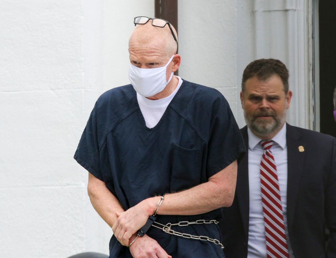 Alex Murdaugh is escorted out of the Colleton County Courthouse in Walterboro, South Carolina, on July 20, 2022, after pleading not guilty to murder and being denied a bond hearing in the deaths of his wife and son.