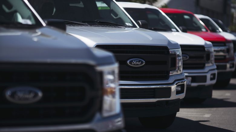 The blue Ford emblem is seen on a new trucks at a dealership on September 23, 2022 in Long Beach, California.