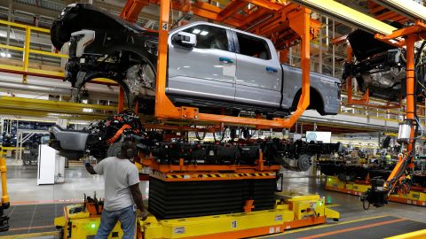 The truck cab is lowered on the frame of Ford Motor Co. battery powered F-150 Lightning trucks.