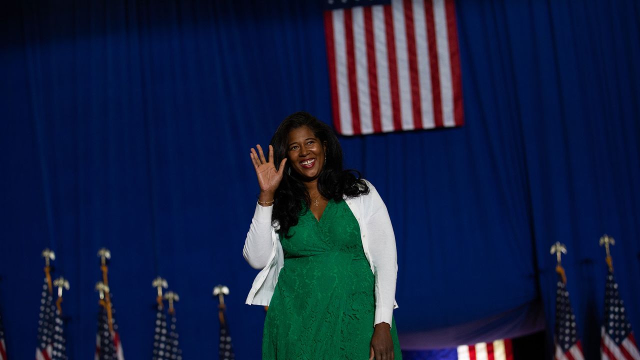 Republican candidate for Secretary of State Kristina Karamo waves to the crowd before she speaks during a Save America rally on October 1, 2022 in Warren, Michigan.