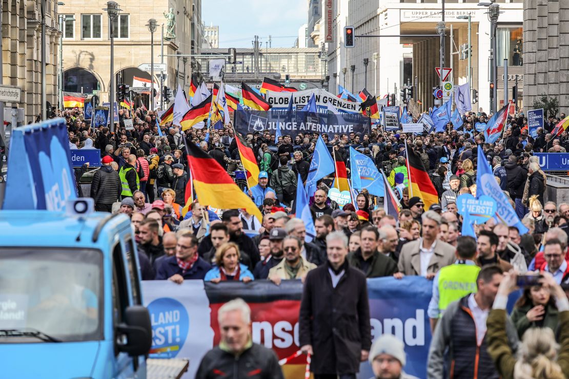 People march to protest against the rising cost of living in a demonstration organized by the right-wing Alternative for Germany (AfD) political party on October 8, 2022 in Berlin, Germany.
