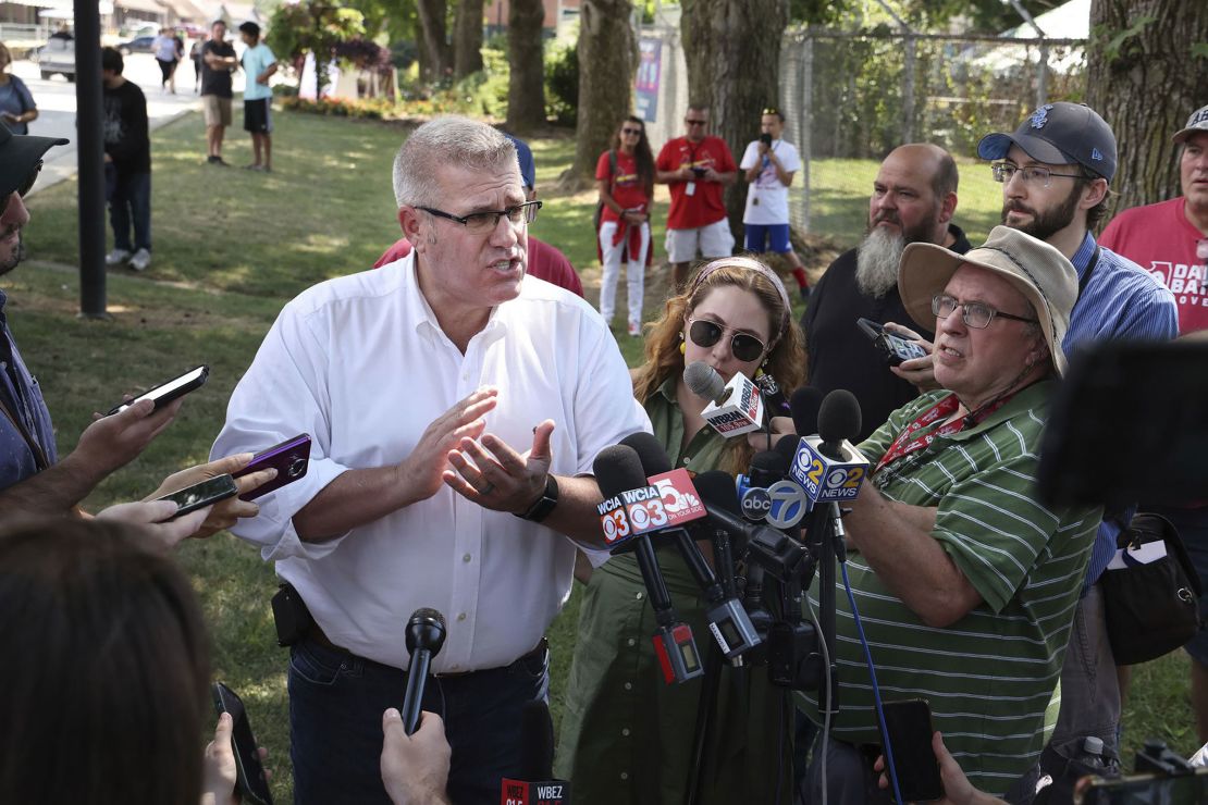 In this August 2022 photo, Darren Bailey talks to reporters after speaking at a rally on Republican Day at the Illinois State Fair in Springfield, Illinois.