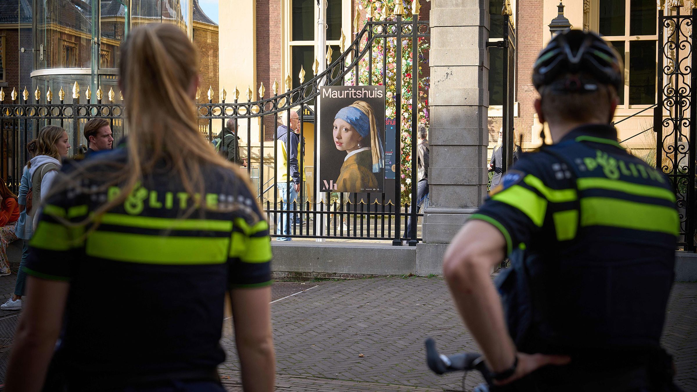 Police stand guard outside the Mauritshuis museum in The Hague in October 2022, after Johannes Vermeer's "Girl with a Pearl Earring" was targeted by climate activists.