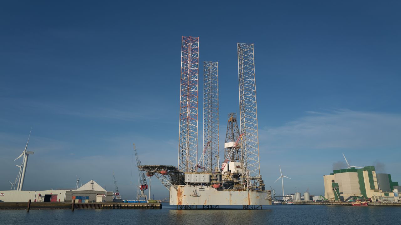 EEMSHAVEN, NETHERLANDS - OCTOBER 31: Wind turbines and an offshore platform are seen in the port of Eemshaven on October 31, 2022 in Eemshaven, Netherlands. Dutch ports play a crucial role in the hydrogen economy, as well as providing key logistical support in delivering gas since the Russian invasion of Ukraine affected energy sources in Europe. (Photo by Pierre Crom/Getty Images)