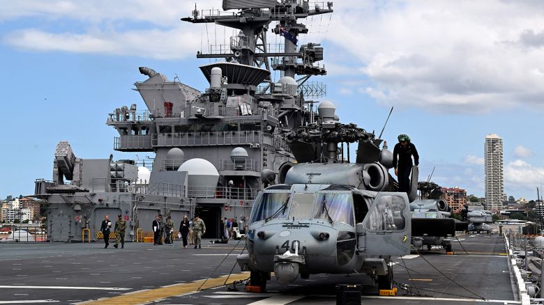 An MH-60 Seahawk is seen on the flight deck of the US Navy's USS Tripoli amphibious assault ship while docked at fleet base in Sydney on November 4, 2022.