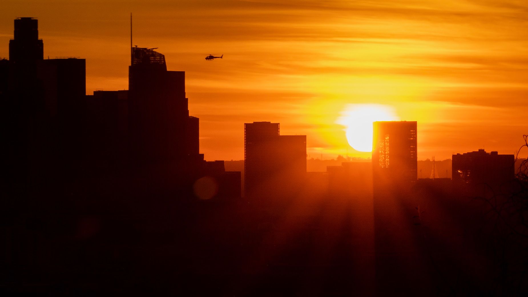 The sun sets behind downtown Los Angeles on December 21, 2022. The City of Angels will have nine hours and 53 minutes of daylight on winter solstice.