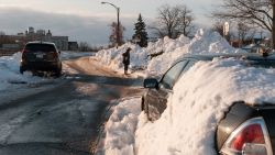 A car makes its way on Humboldt Parkway in Buffalo, New York, on December 29, 2022. - The death toll from a fierce winter storm that gripped much of the United States over Christmas rose to at least 61, officials said. Erie County executive Mark Poloncarz said two more deaths had been reported in the western New York region that bore the brunt of the historic storm, bringing the total to 39. (Photo by Joed Viera / AFP) (Photo by JOED VIERA/AFP via Getty Images)