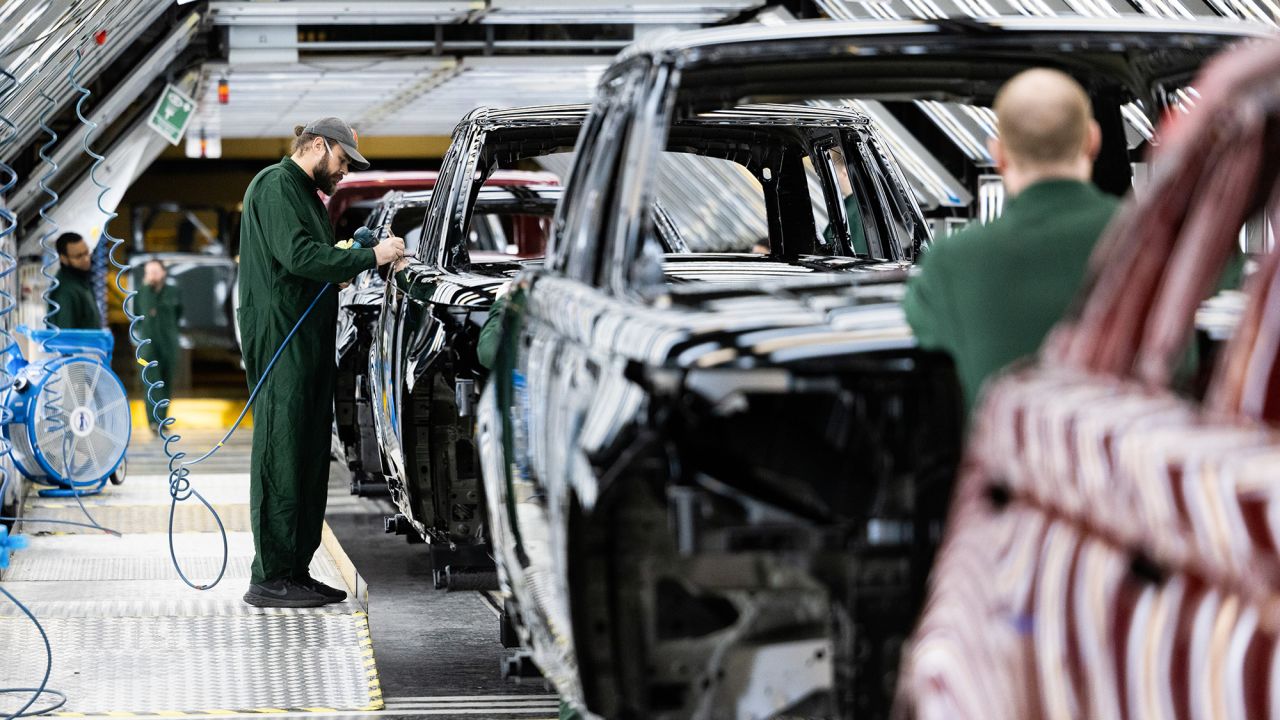 An employee polishes paint on the bodywork of a Range Rover sports utility vehicle (SUV) in the paint shop at Tata Motors Ltd.'s Jaguar Land Rover vehicle manufacturing plant in Solihull, UK, on Friday, Jan. 20, 2023. Tata Motors are due to report their latest results on Wednesday. Photographer: Chris Ratcliffe/Bloomberg via Getty Images