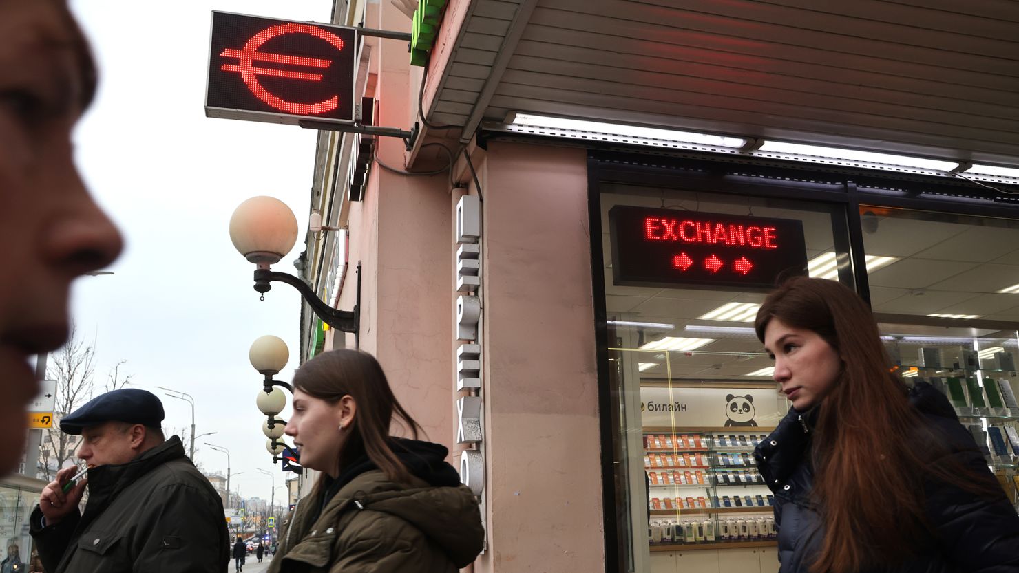 People walk past a foreign exchange office in January 2023 in Moscow.