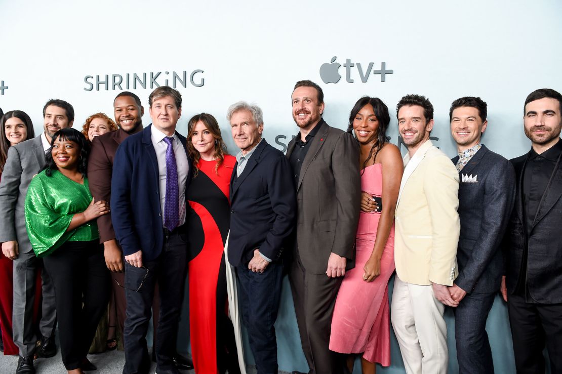 (From left) Liza Katzer, Neil Goldman, Rachel Stubington, Mimi Fletcher, Luke Tennie, Bill Lawrence, Christa Miller, Harrison Ford, Jason Segel, Jessia Williams Michael Urie, Devin Kawaoka and Brett Goldstein at the 2023 premiere of 'Shrinking' in Los Angeles.