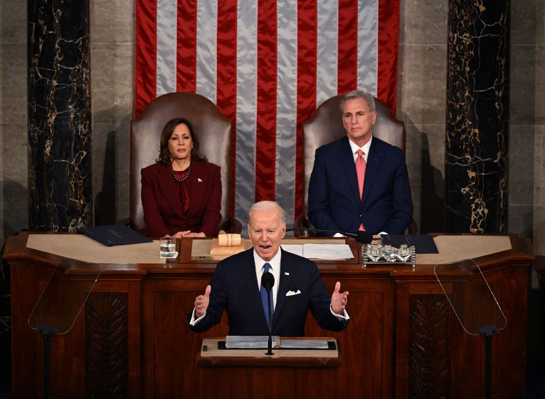 President Joe Biden delivers the State of the Union address, while watched by Vice President Kamala Harris and then-Speaker of the House Kevin McCarthy, in the House Chamber of the U.S. Capitol in Washington, DC, on February 7, 2023.