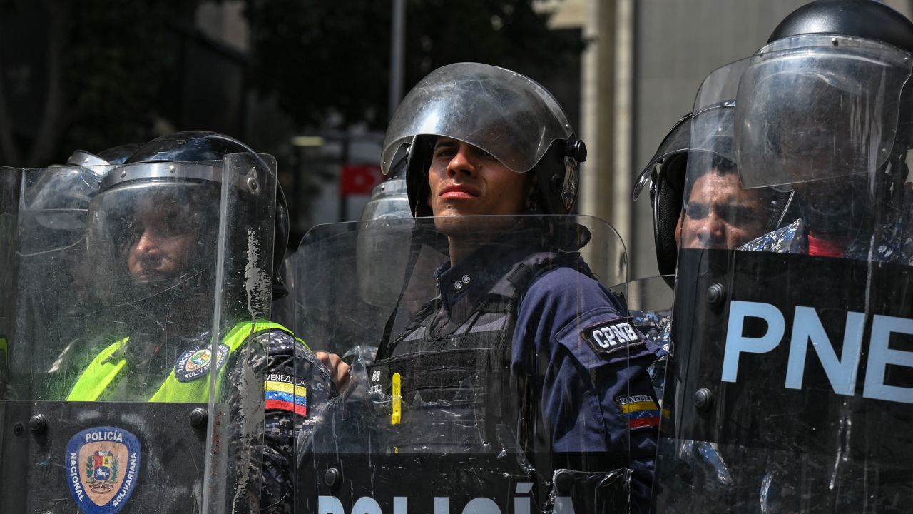 Riot police stand guard during a rally against Venezuelan President Nicolas Maduro on International Youth Day in Caracas, on February 12, 2023. (Photo by Federico PARRA / AFP) (Photo by FEDERICO PARRA/AFP via Getty Images)