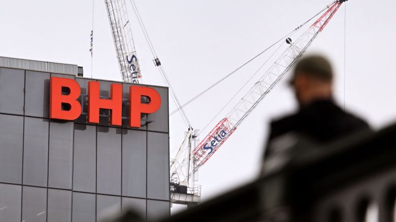 The company logo adorns the side of the BHP gobal headquarters in Melbourne on February 21, 2023. - The Australian multinational, a leading producer of metallurgical coal, iron ore, nickel, copper and potash, said net profit slumped 32 percent year-on-year to 6.46 billion US dollars in the six months to December 31. (Photo by William WEST / AFP) (Photo by WILLIAM WEST/AFP via Getty Images)