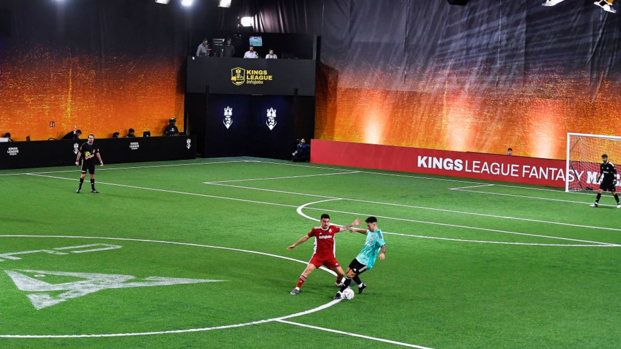 Players of Jijantes FC (L) and PIO FC teams vie for a ball on a 2x2 time during the sixth Kings League match day at el Cupra Arena stadium in Barcelona, on February 12, 2023. - A masked La Liga player, a special card to send off an opponent, club presidents taking penalties and Gerard Pique himself opining on a new rule voted for by viewers. Something exciting is always happening in the former Barcelona defender's Kings League, a competition he created, taking the internet by storm. (Photo by Pau BARRENA / AFP) (Photo by PAU BARRENA/AFP via Getty Images)