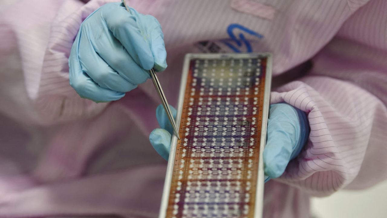 This photo taken on February 28, 2023 shows a worker producing semiconductor chips at a workshop in Suqian, in China's eastern Jiangsu province. (Photo by AFP) / China OUT (Photo by STR/AFP via Getty Images)