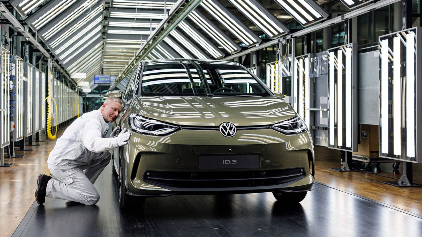 A VW employee presents the new Volkswagen ID.3, the carmaker's flagship electric passenger car, at its factory in Dresden, Germany, in March 2023.