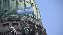 Picture of the flag of Argentina fluttering at the Congress building taken while Argentine President Alberto Fernandez attends the opening of the regular sessions of Congress in Buenos Aires on March 1, 2023. (Photo by Luis ROBAYO / AFP) (Photo by LUIS ROBAYO/AFP via Getty Images)