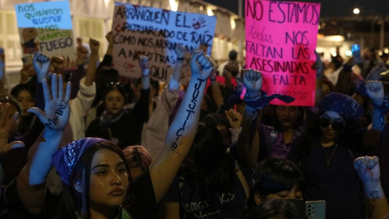 Demonstrators take part in a protest in support of women's rights during the International Women's Day on the Paso del Norte International Bridge that crosses the Rio Grande connecting the US-Mexico border cities of El Paso, Texas, and Ciudad Juarez, Chihuahua state, Mexico on March 8, 2023. (Photo by Herika Martinez / AFP) (Photo by HERIKA MARTINEZ/AFP via Getty Images)