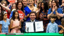 Florida Gov. Ron DeSantis reacts after signing HB 7, the Individual Freedom bill, also dubbed the "Stop Woke Act," in 2022.