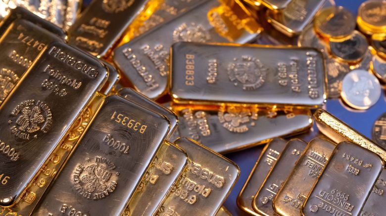 Gold bars and gold coins lie in a safe at the precious metal dealer Pro Aurum in Munich, Germany in March 2023.