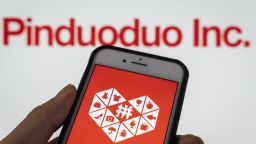 The PDD Holdings Inc. logo arranged on a smartphone in Hong Kong, China, on Tuesday, March 21, 2023.