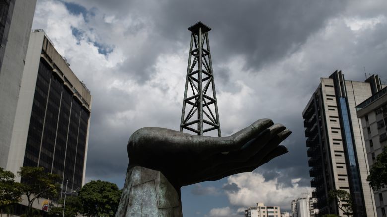 A sculpture of a hand holding an oil well outside Petroleos de Venezuela headquarters in Caracas, Venezuela.