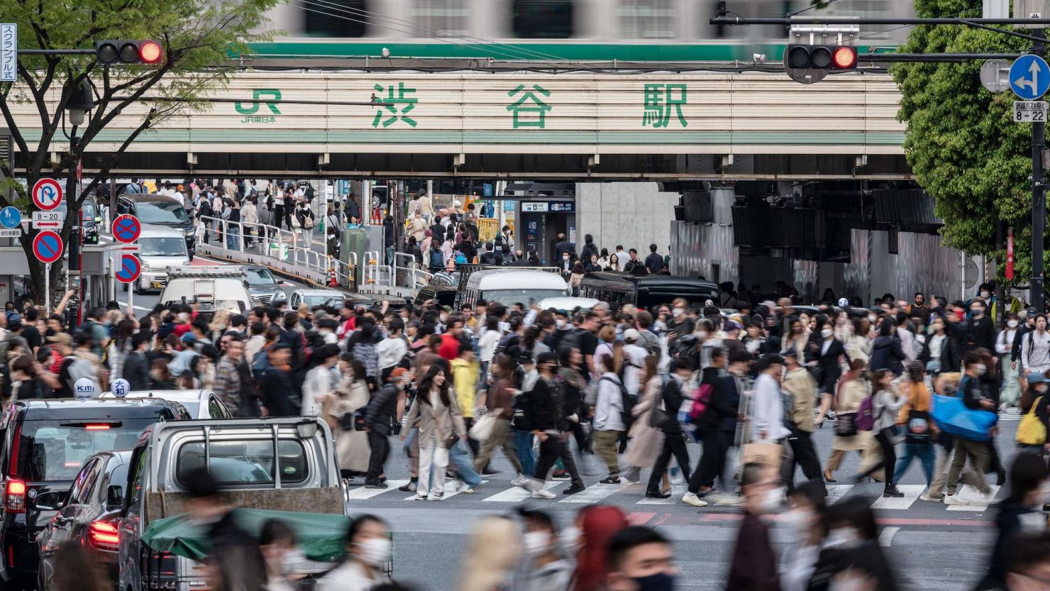 Crowds of people cross the street at Shibuya Crossing, one of the busiest intersections in the world, in the Shibuya district of Tokyo on April 5, 2023.