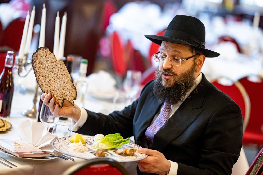 Rabbi Yehuda Teichtal, chairman of the Chabad Jewish Educational Center in Berlin, prepares matzos and the Seder plate at the beginning of Passover.