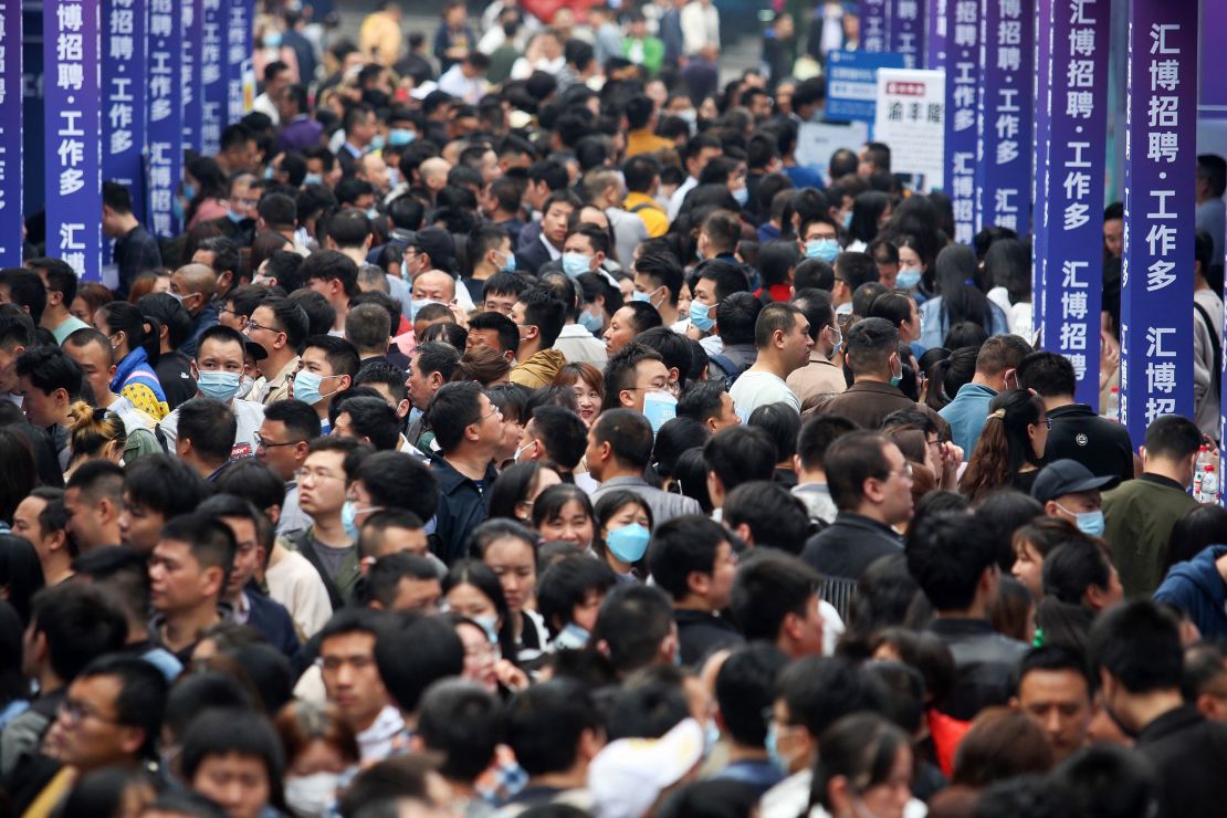 People attend a job fair in China's southwestern city of Chongqing last spring.