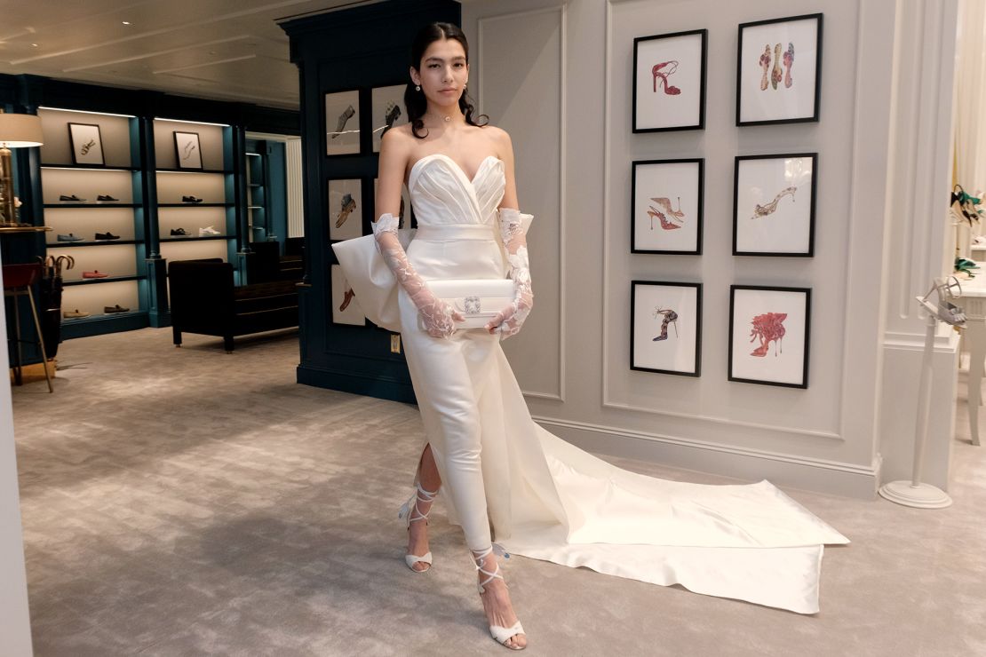 A model showcases a dramatic wedding gown during the presentation of Andrew Kwon's bridal collection in New York City on April 12, 2023.