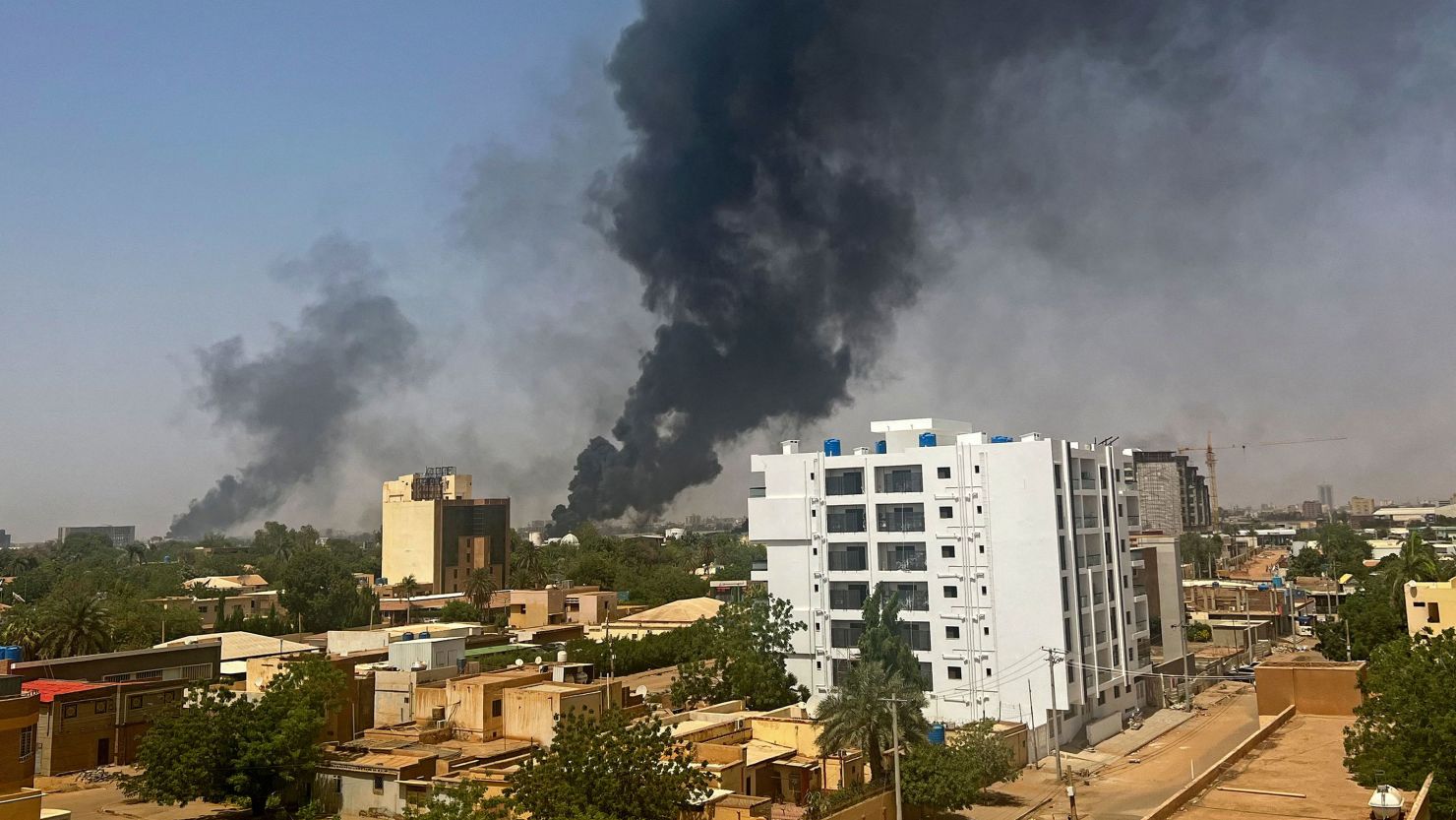 Smoke billows above residential buildings in Khartoum, Sudan, on April 16, 2023, as fighting in Sudan raged for a second day in battles between rival generals.
