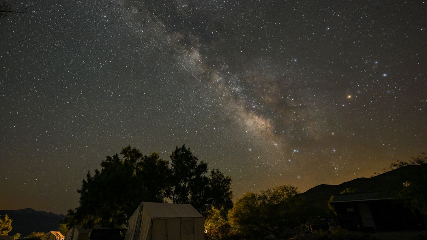 The annual Lyrid meteor shower as well as the Milky Way are visible in the skies above Panamint Springs, California, in April 2023.