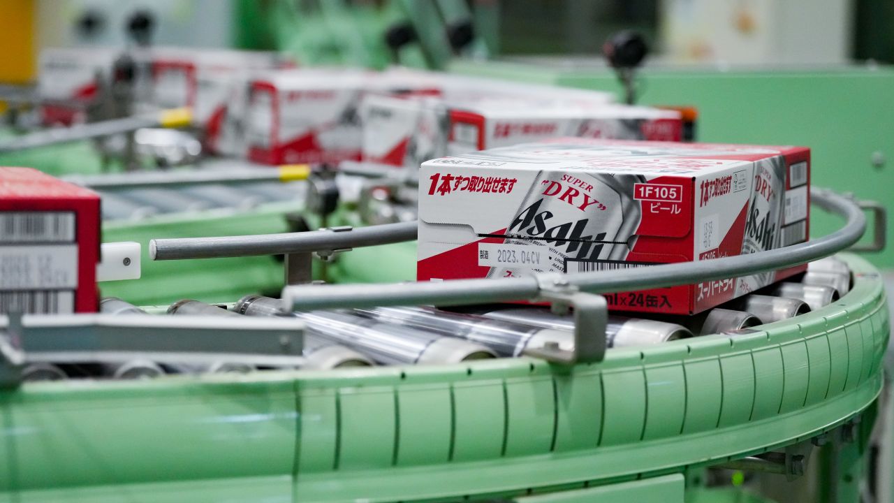 Boxes containing cans of Asahi Super Dry beer move on the production line inside the Asahi Breweries Ibaraki plant, operated by Asahi Breweries Holdings, in Moriya, Japan.