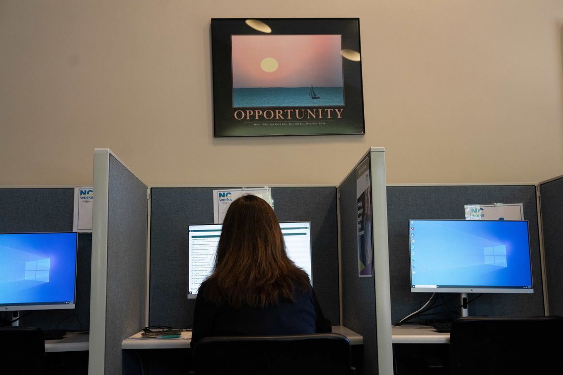 An attendee fills out job applications at a Novant Health Career Fair at NC Works in Wilmington, North Carolina, on April 20, 2023.