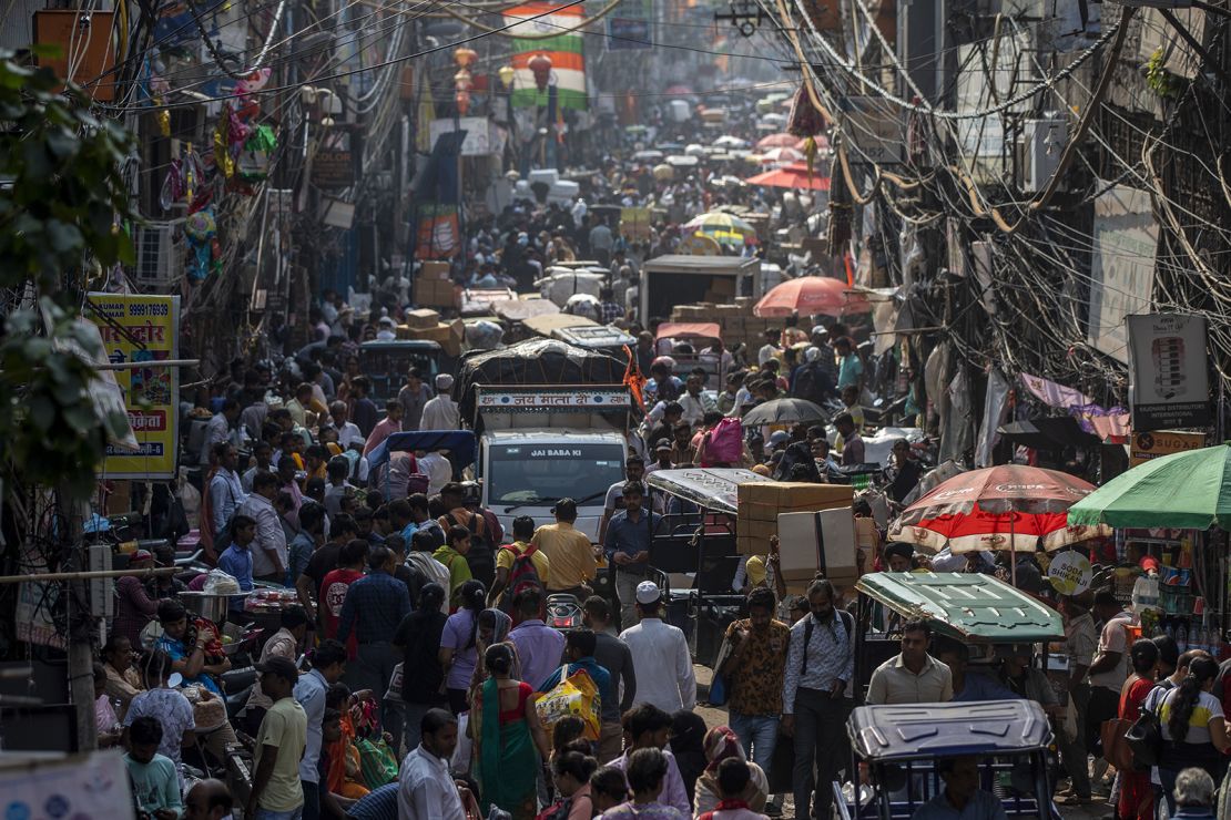 People shop at a crowded market in New Delhi, India on May 04,2023.