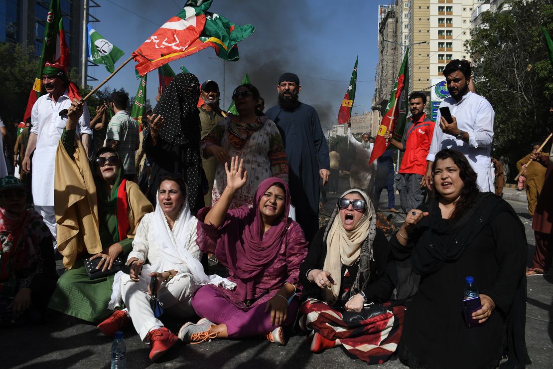 Supporters of Former Prime Minister Imran Khan and his political party Pakistan Tehreek-e-Insaf (PTI) take part in a protest against the arrest of their leader at Shahrah-e-Faisal in Karachi, Pakistan on May 9, 2023.