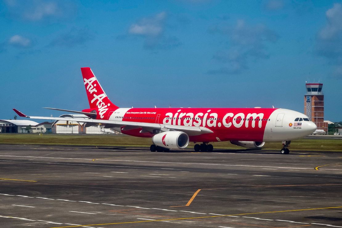An Airasia passenger plane prepares for take-off at the I Gusti Ngurah Rai International Airport in Denpasar on Indonesia's resort island of Bali on May 13, 2023. (Photo by BAY ISMOYO / AFP) (Photo by BAY ISMOYO/AFP via Getty Images)