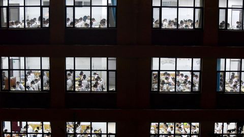 This photo taken on May 17, 2023 shows high school students going through exam papers, ahead of the National College Entrance Examination (NCEE), known as "gaokao", in Handan, in China's northern Hebei province.