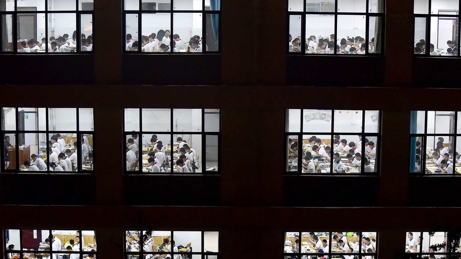 High school students going through exam papers, ahead of the National College Entrance Examination (NCEE), known as "gaokao", in Handan, in China's northern Hebei province.