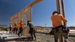 Contractors raise a framed wall on a house under construction at the Toll Brothers Regency at Folsom Ranch community in Folsom, California, US, on Thursday, May 18, 2023.
