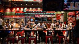 TOPSHOT - People dine at a restaurant at a shopping mall in Beijing on May 26, 2023. (Photo by Jade Gao / AFP) (Photo by JADE GAO/AFP via Getty Images)