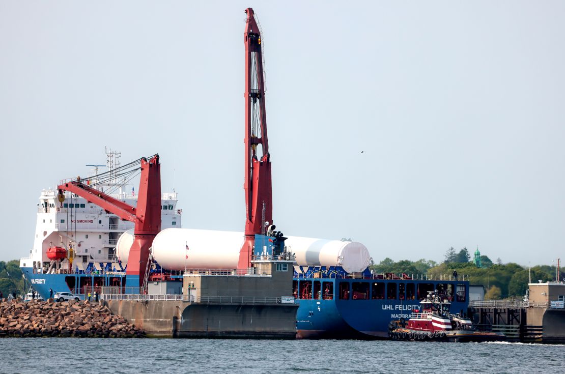 The first shipment of wind turbine parts for the Vineyard Wind farm travels through the New Bedford hurricane barrier in Massachusetts in 2023.