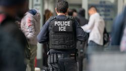 NEW YORK, NEW YORK - JUNE 6: An ICE agent monitors hundreds of asylum seekers being processed upon entering the Jacob K. Javits Federal Building on June 6, 2023 in New York City. New York City has provided sanctuary to over 46,000 asylum seekers since 2013, when the city ed a law prohibiting city agencies from cooperating with federal immigration enforcement agencies unless there is a warrant for the person's arrest.(Photo by David Dee Delgado/Getty Images)