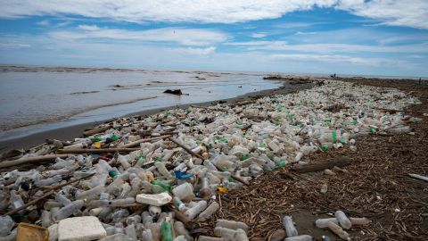 Garbage, including plastic waste, is seen at Paparo Beach in Miranda State, Venezuela, on June 6, 2023. Tons of garbage that includes hospital waste, bottles and plastic containers, wood, among other materials that are collected by the Guaire and Tuy rivers in their journeys through the Venezuelan states of Miranda and Aragua, reach the beach through the mouth at Paparo beach. (Photo by Yuri CORTEZ / AFP) (Photo by YURI CORTEZ/AFP via Getty Images)