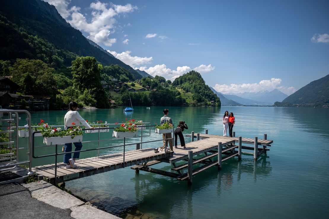 Tourists at Lake Brienz in the Swiss Alps.