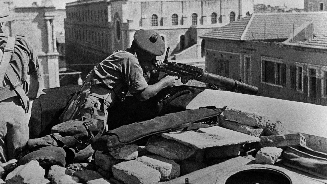 A British soldier uses a machine gun to monitor and control the streets of Jerusalem from the roof of a house following an upsurge in attacks in March 1947 during the British Mandate in Palestine. On November 29, 1947, the United Nations' General Assembly voted resolution 181 on the partition of Palestine in two states, one Jewish and one Arab. Jerusalem was to remain under international control. The State of Israel was proclamed on 14 May 1948 by the Jewish National Council and was recognized by the United States and the Soviet Union 15 and 17 May the same year. Arab States of Lebanon, Syria, Jordan, Egypt and Iraq crossed the borders from north, east and south with their regular armies 15 May 1948. Agreements signed in 1949 between Israel and the Arab States ended the 1948 Arab-Israeli War, and established the armistice lines between Israel and the West Bank, also known as the Green Line, until the 1967 Six-Day War. (Photo by PRESSE VOIR / AFP) (Photo by -/ PRESSE VOIR/AFP via Getty Images)