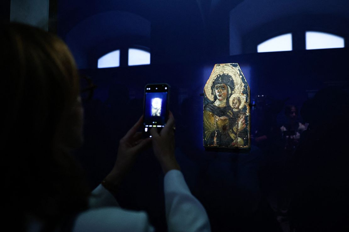 A visitor admires the work "Virgin and Child," dating from the 6th century, from Kyiv's Khanenko Museum, on display at the Louvre in Paris.