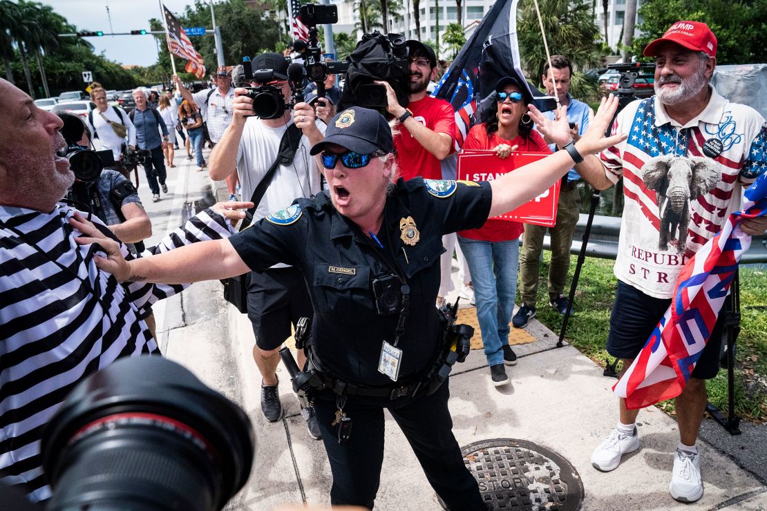 Supporters of former President Donald Trump clash with protestors outside his Trump National Doral resort on June 12, 2023, in Doral, Florida.