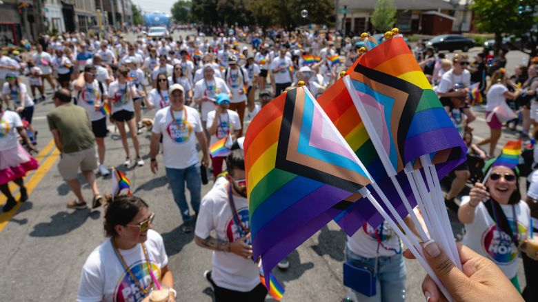 LOUISVILLE, KENTUCKY - JUNE 17: Parade participants holding Pride flags are seen during the Kentuckiana Pride Parade on June 17, 2023 in Louisville, Kentucky.  According to the American Civil Liberties Union, nearly 500 anti-LGBTQ+ bills have been introduced across the U.S. in state legislatures since the beginning of 2023. (Photo by Jon Cherry/Getty Images)